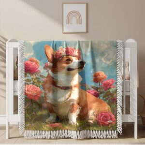 A Corgi is sitting on the grass with a rose Woven Blanket