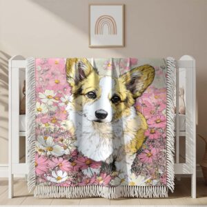 A corgi in a flower field Woven Blanket